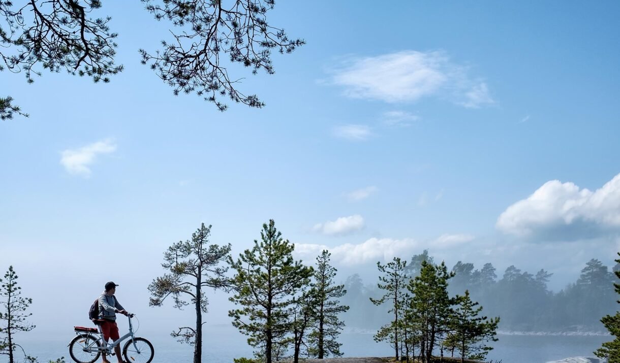 young men riding a bicycle on bike trail at the la hffqt7g