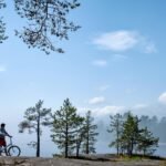 young men riding a bicycle on bike trail at the la hffqt7g