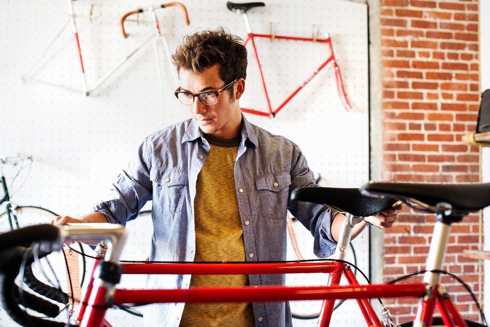 a man working in a bicycle repair shop kqa7yzb.jpg